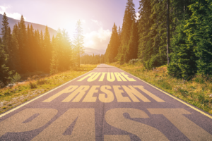 A road that has the word future present written on it.